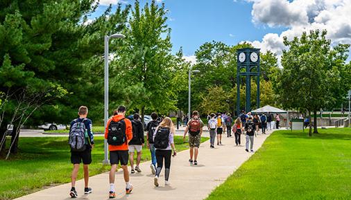 Students walking in front of clocktower